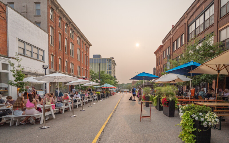 Sweetwaters Coffee and Tea, The Earle, and Frida Batidos on the left, Grizzly's and Cafe Zola on the right. Washington Street Social District Ann Arbor MI Sweetwaters, The Earle, and Frida Batidos on the left, Grizzly Peak Brewing and Cafe Zola on the right.