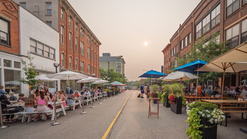 Washington Street Social District Ann Arbor MI Sweetwaters, The Earle, and Frida Batidos on the left, Grizzly Peak Brewing and Cafe Zola on the right.