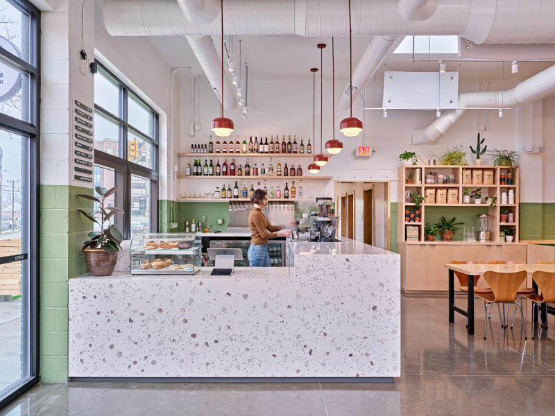 Image of bright cafe interior with cafe counter and barista at Ann Arbor's Northside neighborhood hangout, courtesy of the Lowertown Bar &amp; Cafe website.